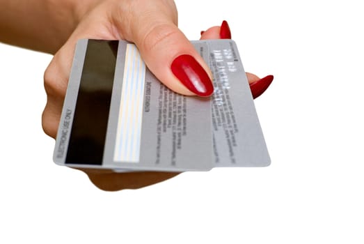 The female hand holds two credit cards