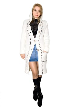 Beautiful model in a white knitted coat