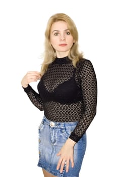 The beautiful woman in a black blouse and a jeans skirt
