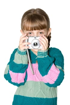 The girl in a color sweater holds the digital camera