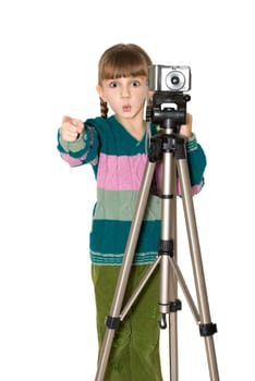 The girl in a color sweater looks out because of the digital camera