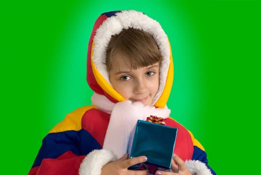The little girl with a gift on the green background