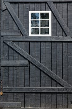 Detailed view of a barn door and window