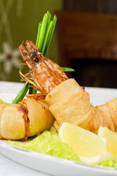 shrimps, with lettuce, green onion, lemon and black olive
