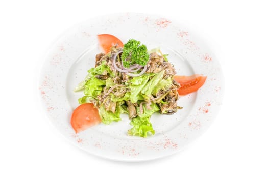Salad of squid with roast chicken meat, apples, tomatoes, eggs and peppers