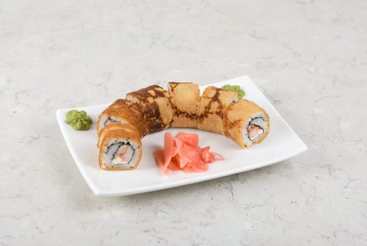 Sushi - made of crab meat, cheese, pancake outside