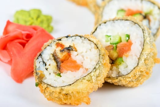 Sushi rolls at plate isolated on a white