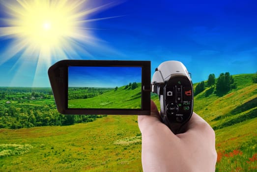 summer landscape of green valley recording at camcorder