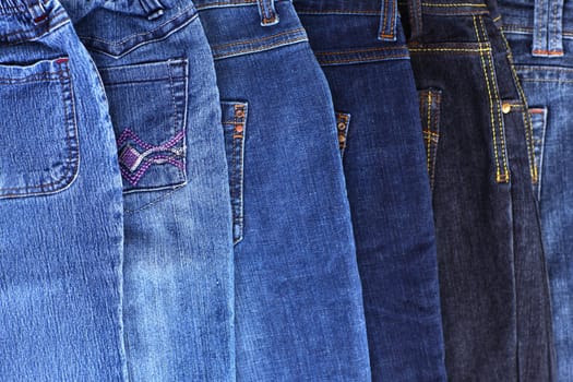 Stack of different jeans - detail