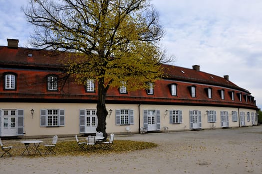 view of the secondary service buildings of the famous castle located in a park in surroundings of the city, they are developed on an elliptic plan