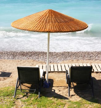 Beach chairs and umbrella on a beach