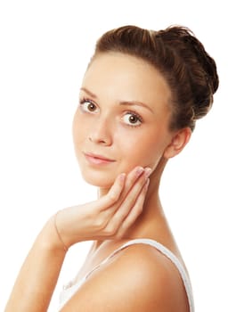 Young beautiful woman is touching her face. Isolated over white background