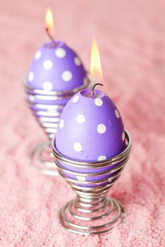 Close-up of purple dotted Easter egg candles