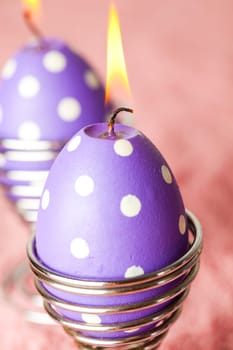 Close-up of purple dotted Easter egg candles