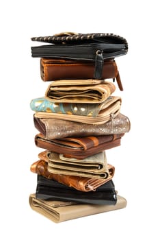 10 leather purses in stack. Isolated on white background