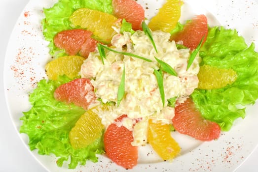 seafood salad of shrimp baked at cream with orange and grapefruit isolated on a white background