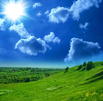 summer landscape of green valley and blue sky