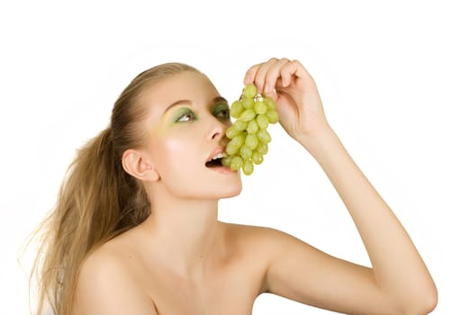 Pretty young woman with grape on the white background