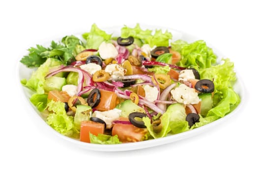 greece salad at plate isolated on a white