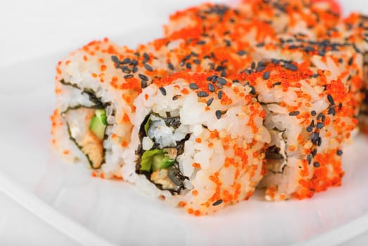 Sushi rolls at plate isolated on a white
