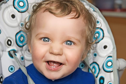 pretty baby boy laughing portrait closeup