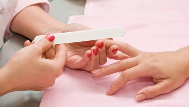 Female hands closeup at manicure process