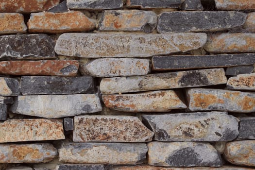 A section of a roughly built sandstone wall
