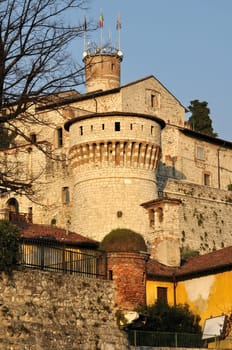 foresight of medieval castle on a hill towering above the town