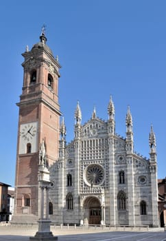 higly decorated main facade of the famous church prospecting on a square in city center, shot in bright light
