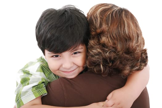 Mother carrying young son looking to camera