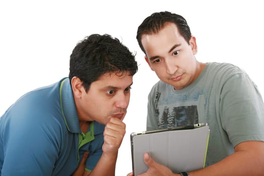 Two friends looking surprised at tablet computer against a white background