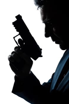 one caucasian spy criminal policeman detective man holding gun portrait silhouette in studio isolated white background