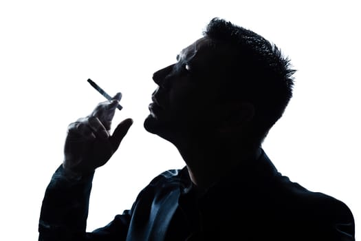 one caucasian man portrait smoking cigarette silhouette in studio isolated white background