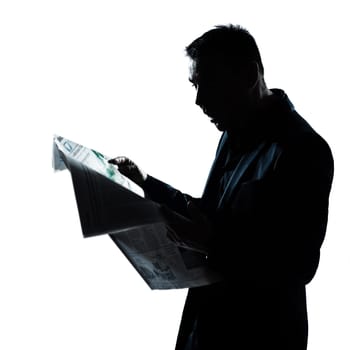 one caucasian man portrait silhouette reading newspaper surprised in studio isolated on white background