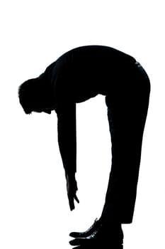 one caucasian man stretching back full length silhouette in studio isolated white background