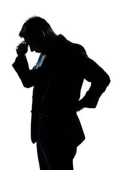 one caucasian man portrait silhouette thinking looking down in studio isolated white background