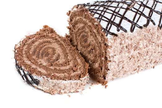 Chocolate Swiss roll closeup isolated on a white background