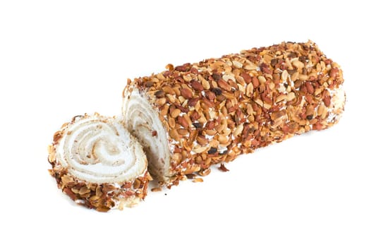 Nuts Swiss roll closeup isolated on a white background