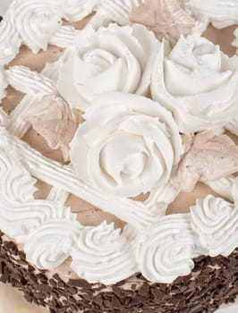 Cream cake closeup isolated on a white