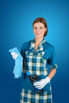 girl cleaner at uniform isolated on a blue