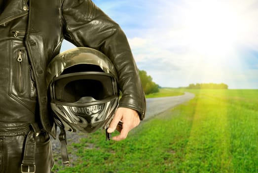 motorcycle biker with helmet closeup on a road