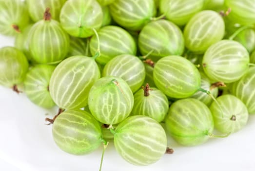 green ripe gooseberries isolated on a white background