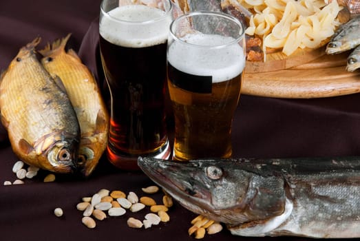 Beer and snacks set: chips, pistachio, shrimp and fish