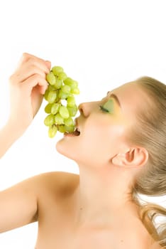 Pretty young woman with grape closeup on the white background
