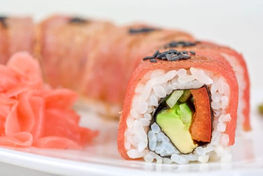 Fuji Sushi rolls made of tuna, pepper, avocado, cucumber