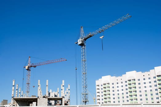 crane and building under construction on the skyline
