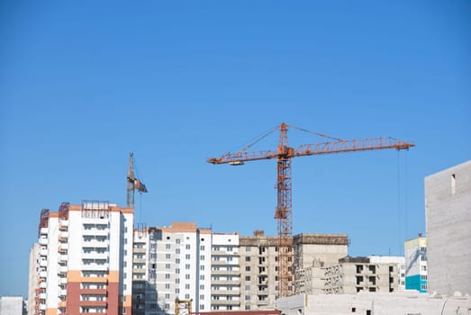 crane and building under construction on the skyline