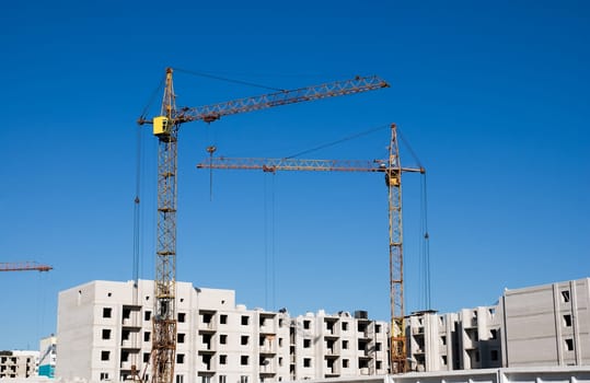 crane and building under construction on the skyline