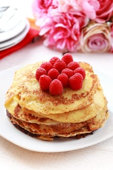 Sweet pancakes with fresh raspberries