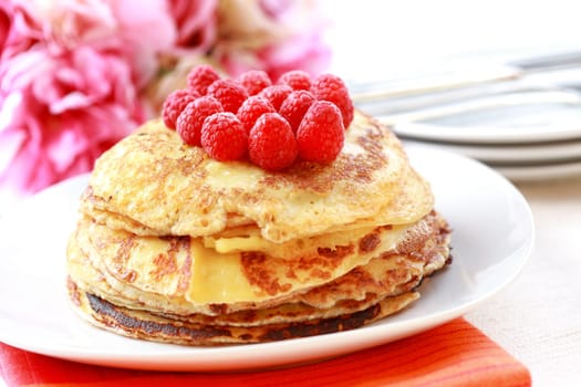 Sweet pancakes with fresh raspberries
